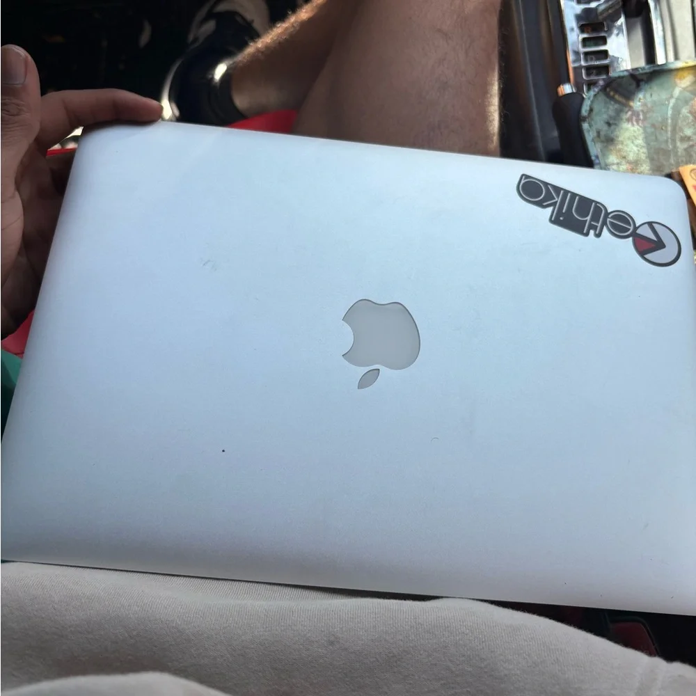 Apple Laptop with Silver Finish and Sticker. 2015